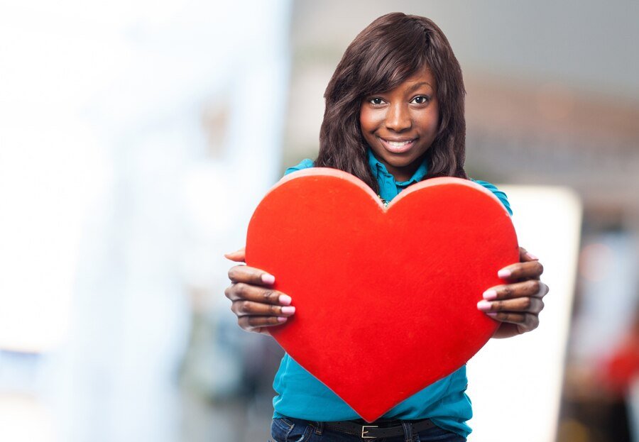 young-woman-holding-big-red-heart_1149-388